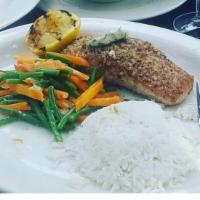 Dinner Wild Pecan Crusted Salmon · Lemon dill sauce with basmati rice and vegetables.