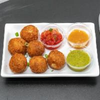 Fritters · Similar to a samosa but without the wrapper. potatoes, peas, sweet potatoes and lentils form...