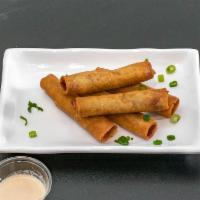 Lola's Lumpia · 5 pieces. Filipino style egg rolls filled with ground beef, carrots and green onion. Served ...