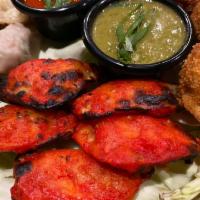 Tandoori Paneer Momo · 8 pcs of Momos are bite-size dumplings with Paneer filling cooked in Tandoor, wrapped in a d...