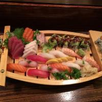 Love Boat for 2 · 16 pieces of sashimi, 12 pieces of sushi and three rolls. Served with your choice of side.