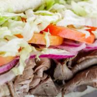 Prime Sandwich · Slow roasted beef, cream cheese, mayo, horseradish, sweet onion, tomatoes and lettuce on an ...