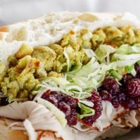 Sundown Sandwich · Roasted turkey breast, mayo, herb stuffing, lettuce and cranberries on an 8