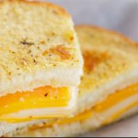 Gourmet Grilled Cheese Sandwich · Delicious cheddar, provolone and American cheese with gourmet sauce on Parmesan crusted sour...