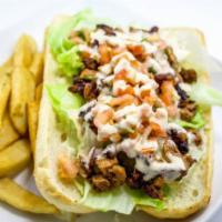 Torta Salvadorena Sandwich · Seasoned chicken, house sauce, lettuce, and pico de gallo, mayo with fries.