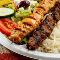 Rice Platter · White Basmati rice, fresh Greek salad, grilled Grecian pita, and choice of kabobs. You can o...