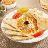 Hummus and Pita · Fresh daily-made chickpeas dip topped with tomato wedges, Kalamata olive, pepperoncini, papr...
