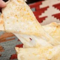 Kid's Cheesy Pita Pizza · Grilled Grecian pita topped with melted provolone cheese, cut into pizza-like slices. Served...
