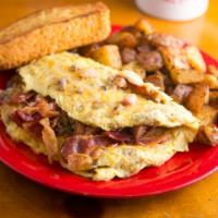 Meat Lovers Omelet · Ham, sausage, crisp bacon and cheddar jack cheese.