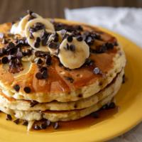 Chunky Chimp Pancakes · Buttermilk pancakes with chocolate chips, bananas and chopped walnuts.