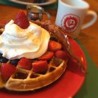 All American Waffle · Topped with cream, strawberries and blueberries.