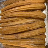 Churros · Fried dough pastry. Rolled in sugar and cinamon.