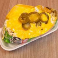 Tostielote · Medium. Whole kernel corn, mayo, cotija cheese, sour cream, chili, lemon, nacho cheese, and ...