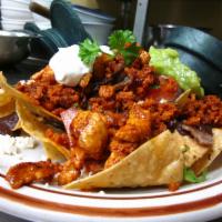 Jacalito Nachos · Chips tpped with black beans, queso fresco, onions, tomatoes, cilantro, sour cream, guacamol...