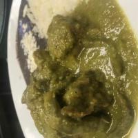 Costilla de Puerco en Salsa Verde con Nopales · Pork ribs and cactus in a spicy green chile salsa. Servido con arroz y frijol.  Served with ...