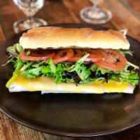 Turkey Sandwich on Ciabatta · Smoked Turkey Slices with our homemade honey mustard sauce served with mixed greens and toma...