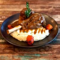 Lamb Shanks · Slow cooked lamb shanks served over cheesy mashed potatoes with demi-glace sauce.