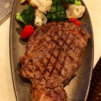 Ribeye Steak · 12 oz. grilled ribeye steak served with french fries, steamed broccoli and cauliflower.