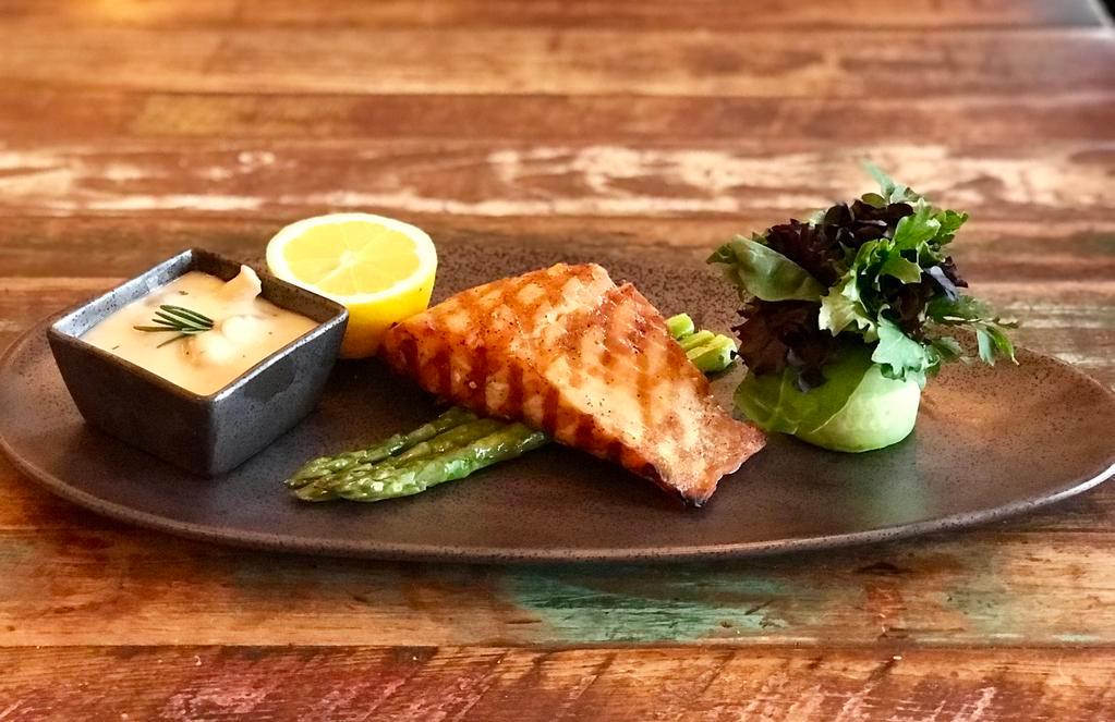 Salmon Fillet · Chargrilled 8 oz. salmon fillet served over sauteed spinach, asparagus, lemon and bouquet greens.