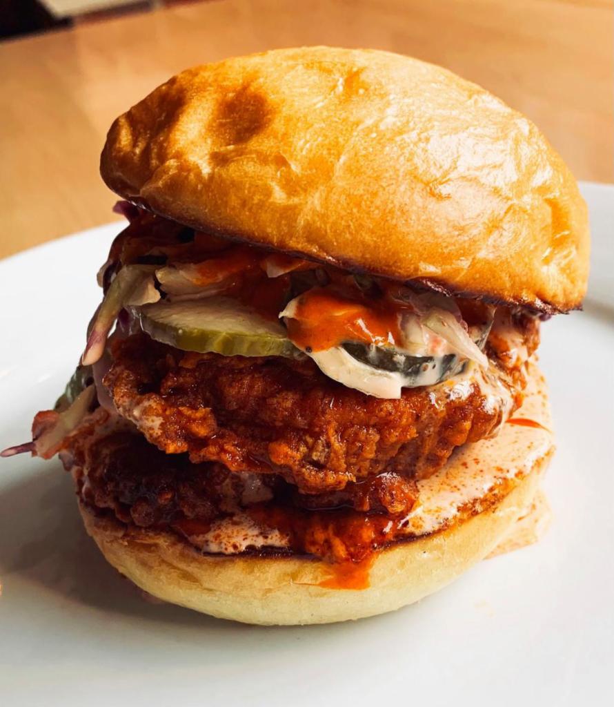 Buttermilk Fried Chicken Sandwich · Buttermilk-fried chicken breast, dill pickle chips, habanero-orange reduction, spicy cole slaw,  house-made bun, served with hand-cut fries. (fried in soy oil)