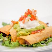 Flautas (GF/NF) · Three rolled and fried corn tortillas filled with seasoned chick'n, topped with shredded let...