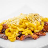 Side Mac & Cheese · House made cheese sauce smothered on top of macaroni noodles, bread crumbs, and mozzerella c...
