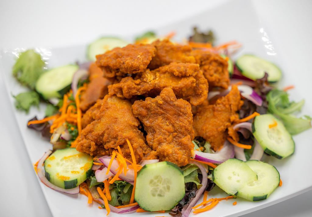 Buffalo Chicken Box (GF) · Cilantro quinoa rice, Spring mix, cucumbers, carrot, and red onion, topped with buffalo soy chick’n