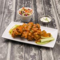 Wings · Your choice of lemon and herb, medium, hot, or hot honey Buffalo served on a bed of Asian sl...