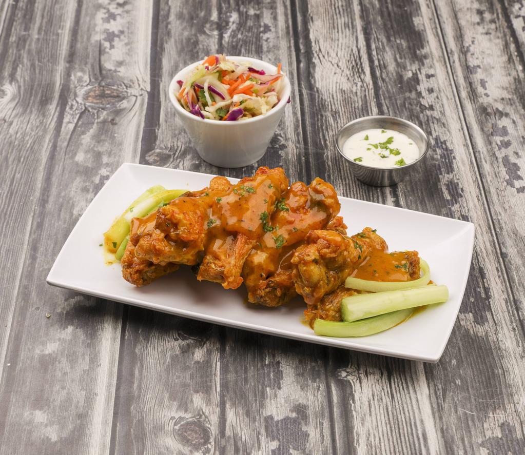 Wings · Your choice of lemon and herb, medium, hot, or hot honey Buffalo served on a bed of Asian slaw. Gluten free.