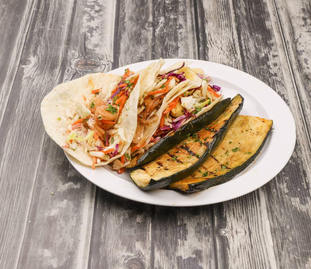3 Taco Combo · With choice of side. Lightly seasoned with a touch of citrus piri-piri spice and humdingers sauce, filled with Asian slaw.