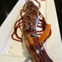 Dragon Roll · Fresh water eel on topped of California roll with eel sauce on top of the roll.