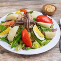 Salad Nicoise · Green beans, potatoes, lettuce, chunks of white tuna, anchovies, tomatoes and boiled eggs.
