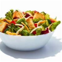 Side Garden Salad · Spring mix greens piled with diced tomatoes, crisp cucumbers, cheddar cheese, Monterey Jack ...