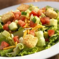 Garden Salad · Spring mix greens piled with diced tomatoes, crisp cucumbers, cheddar cheese, Monterey Jack ...