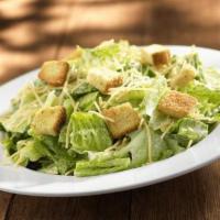 Caesar Salad · Fresh chopped Romaine, Parmesan cheese and crispy season croutons with a creamy Caesar dress...