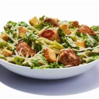 Chicken Caesar Salad · Fresh chopped romaine, Parmesan cheese and crispy seasoned croutons with a creamy Caesar dre...