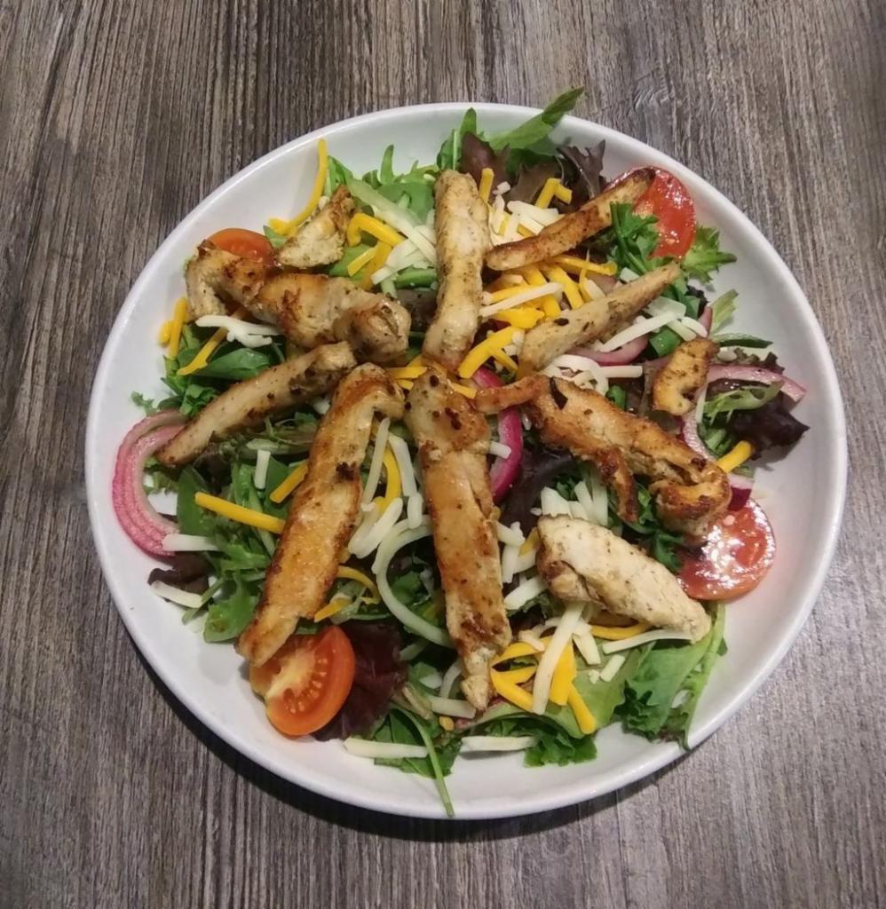 Salad with Fajita Steak or Chicken · Spring mix, Monterey jack & cheddar cheeses, tomatoes, red onions, choice of fajita steak or chicken, choice of dressing