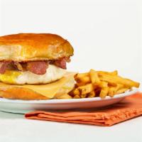 Classic Breakfast Sandwich · 2 fried eggs with a choice of Ham, Bacon, or Sausage with American Cheese on a toasted Brioc...