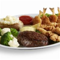 Classic Sirloin Steak Trio · Sirloin steak trio dinner served with four breaded, fried shrimp, and three golden brown, br...
