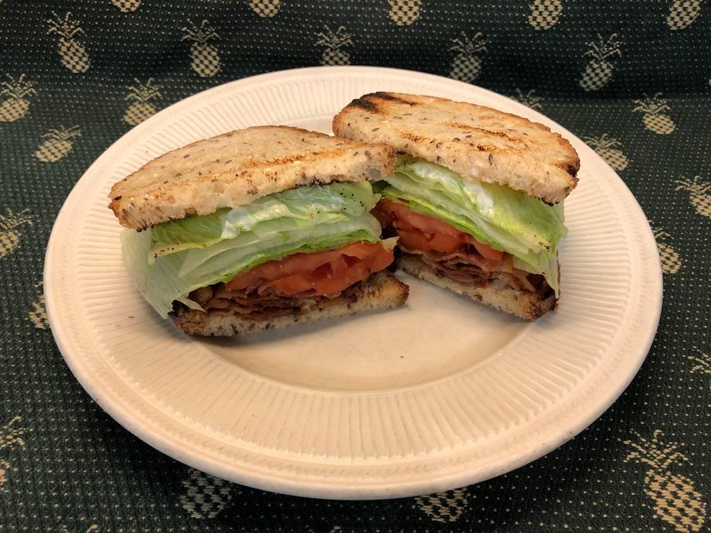 TAVERN BLT ·   Crisp bacon, lettuce, tomato & mayo on choice of toast, with home- made potato chips. Avacado add-on available                      