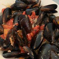 Mussels Caprese · Mussels sautéed in white wine, parsley, lemon, garlic and olive oil.