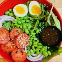 Asian Salad with Sesame Oriental Dressing · Mixed greens, tomato, onions, sesame seeds, egg, edamame and soybeans.