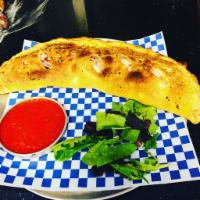 The House Calzone · Pepperoni, sausage, mozzarella cheese and ricotta cheese.