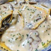 Portabella Mushroom Ravioli · Soft pasta squares filled with portabella mushrooms and topped with your choice if sauce.  S...