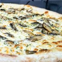 Truffle Mushroom Pizza · Cheese based bianca (white) sauce topped with mushrooms, truffle, parsley and oil.
