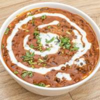 Dal Makhani · Black lentils simmered with tomatoes, chilies, garlic and butter.
