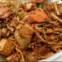 N4. Curry Tofu Flat Noodles · Long flat noodles.