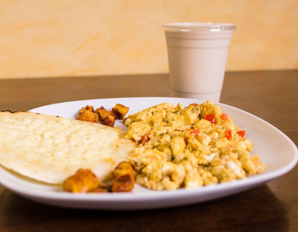 Huevos Al Gusto · Acompanados de arepa con queso o arroz. Eggs any style with cheese topped arepa or rice.