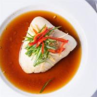 Ginger Steamed Fish · Steamed fish filled bathed in a juicy broth of soy ginger sauce with garlic, fresh ginger an...