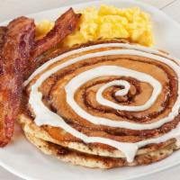 Ultimate Combo · Two flavored pancakes, two eggs, two bacon strips and one sausage patty. 920-2000 cal.			